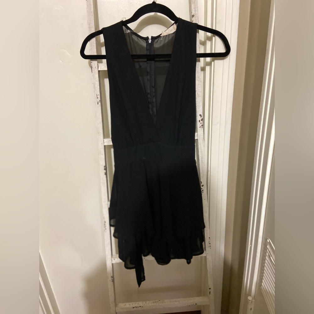 Every lady needs a sexy black go to classy. The back is sheer.